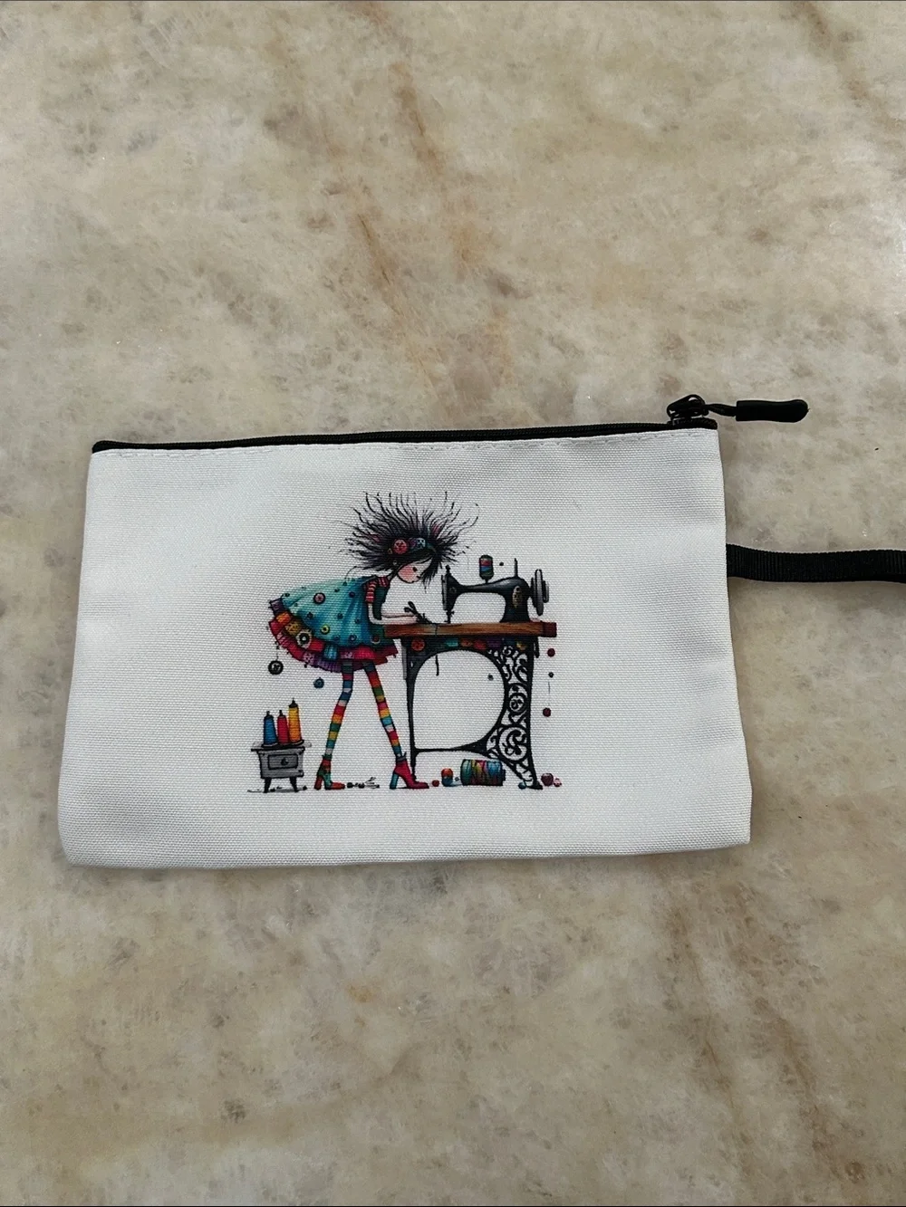 White Printed Wristlet Pouch with Colorful Sewing Illustration